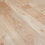 Smooth light brown wooden flooring with natural texture and patterns.